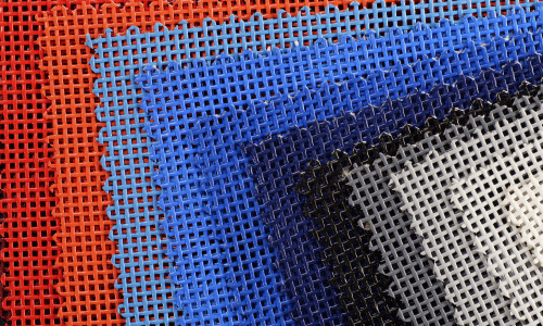 Closeup of colorful mesh banner materials