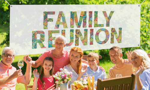 Multi-colored family reunion banner with family seated at picnic table